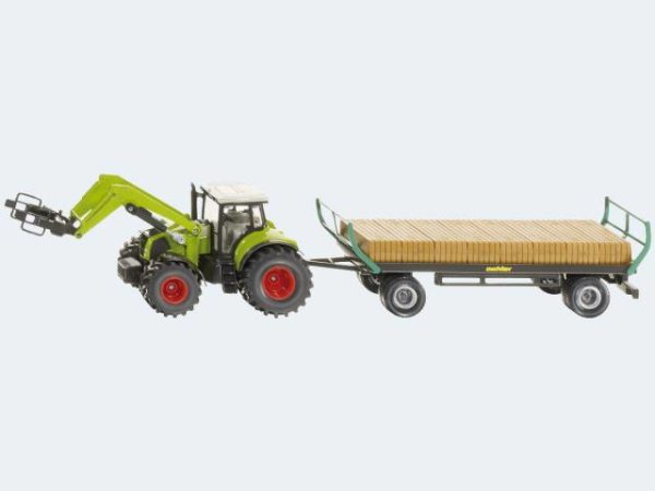 Traktor mit Quaderballen- greifer und Ballenwagen